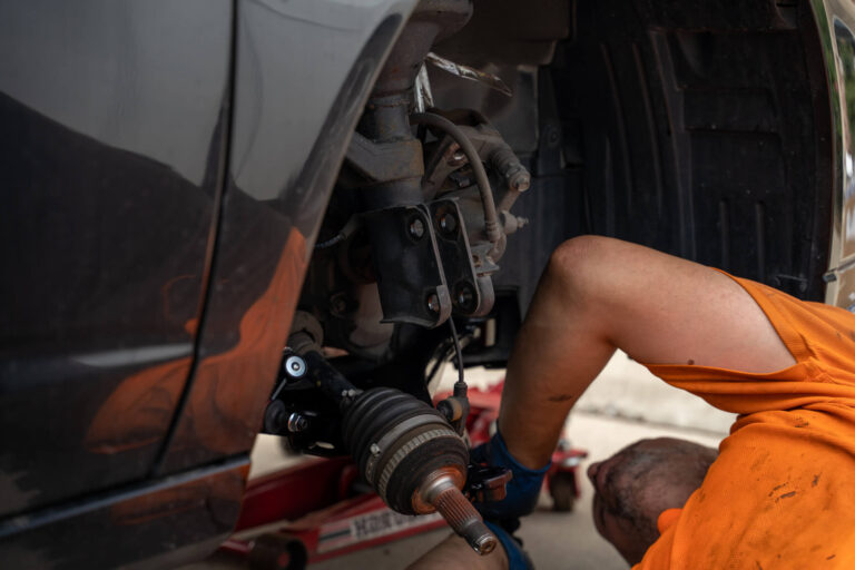Mechanic underneath car